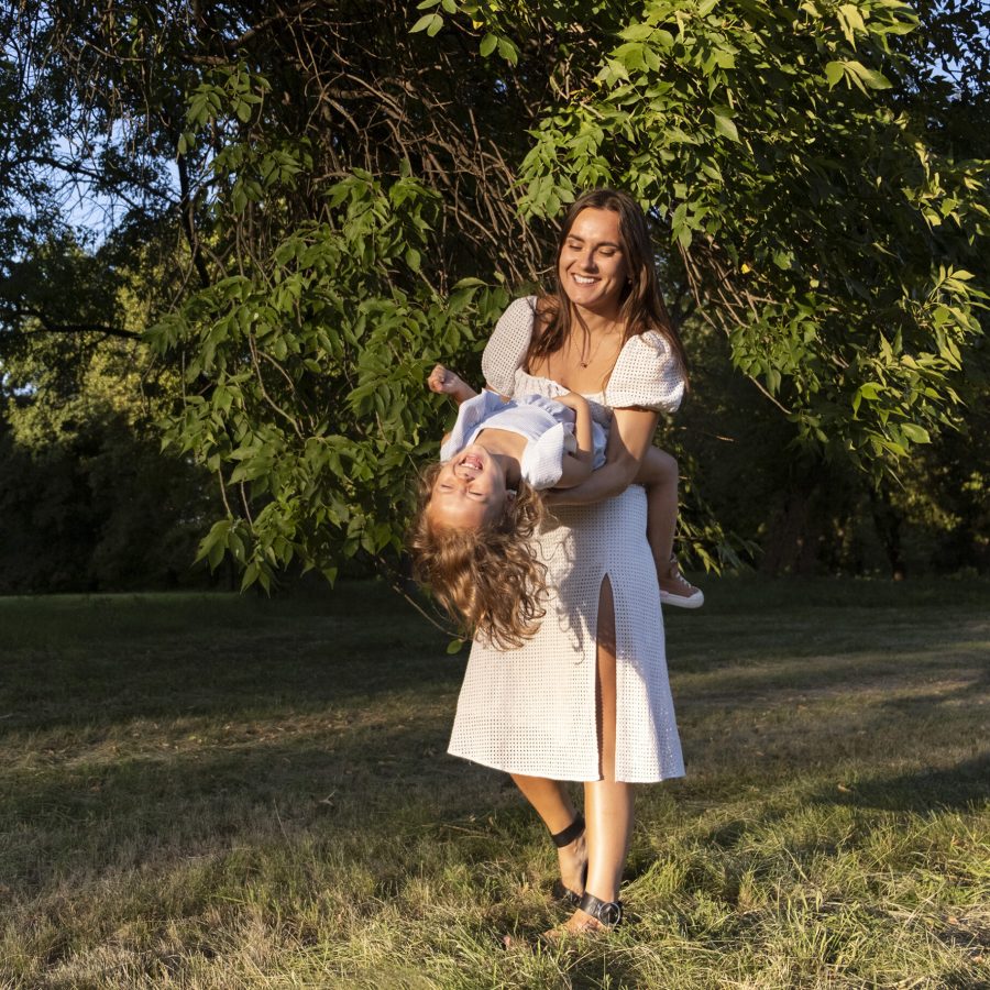 full-shot-woman-playing-with-kid